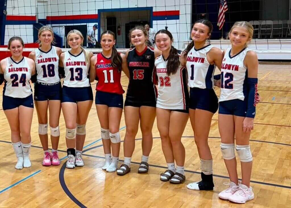 Baldwyn volleyball players line up for a team photo during the 2026 season