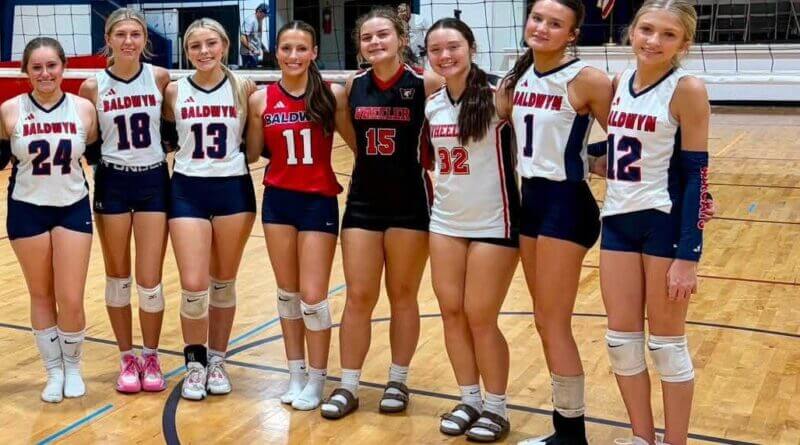 Baldwyn volleyball players line up for a team photo during the 2026 season