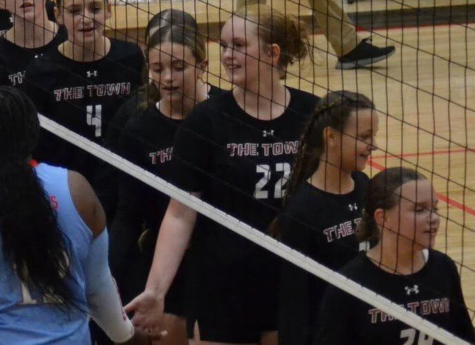Jumpertown volleyball players at the net during a 2026 match