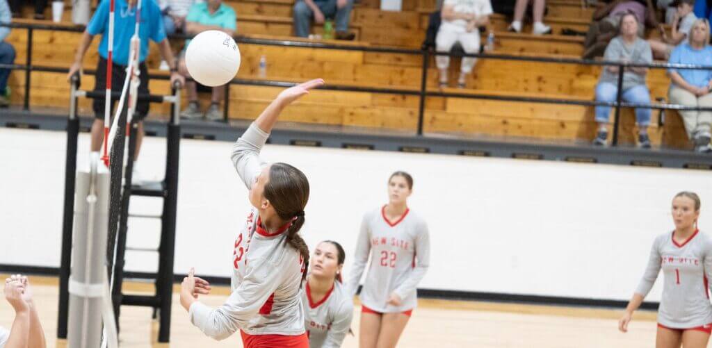 A New Site hitter rises for a kill at the net during a 2026 match